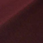Close-up of burgundy grommet curtain folds.