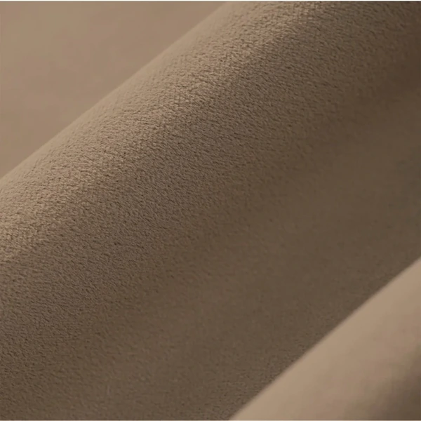 Detailed texture of plush brown velvet fabric for curtains.