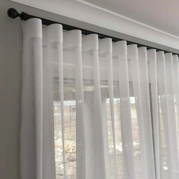 Sheer wave curtain with soft pleats.