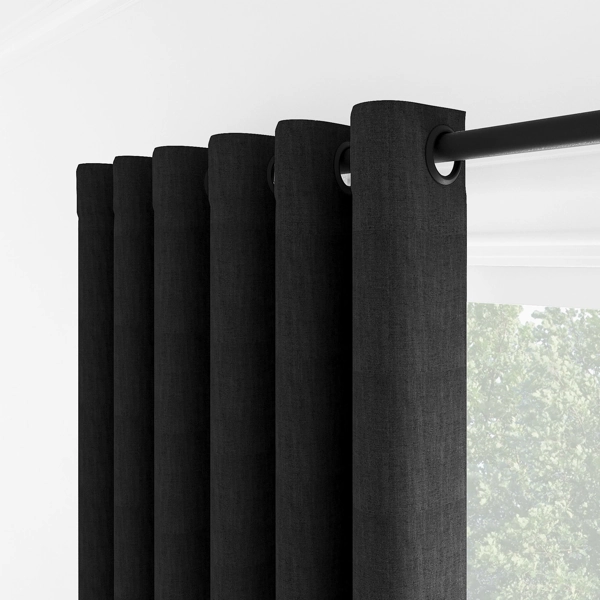 Side view of black grommet curtain pleats