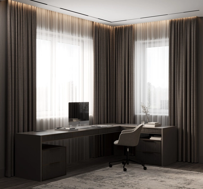 heavy brown blackout curtains with deep, uniform pleats in an office.