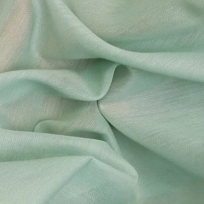 light mint green sheer fabric draped in soft