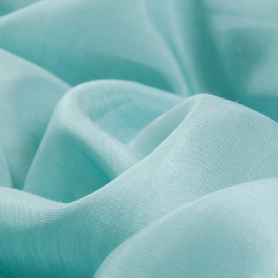 smooth, sheer fabric in a bright aqua